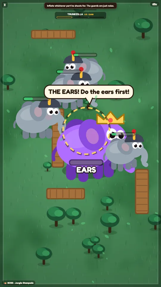 Elephant Pop boss fight. A large purple elephant wearing a crown calls out a body part to inflate while smaller guard elephants crowd around it.