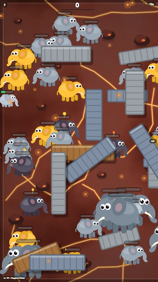 Elephant Pop gameplay, volcano world. Elephants on dark red rock split by glowing lava cracks, with barricades in the way.